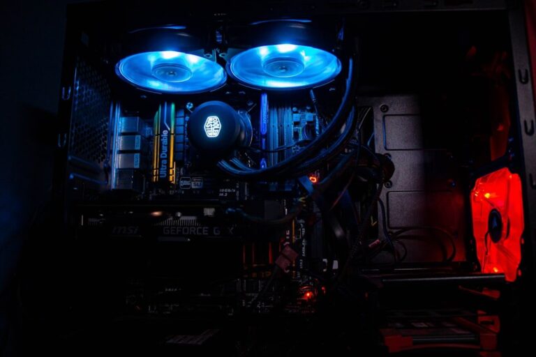 A close-up shot of a powerful NVIDIA RTX graphics card, showing its intricate fans and cooling system, representing high-performance computing.