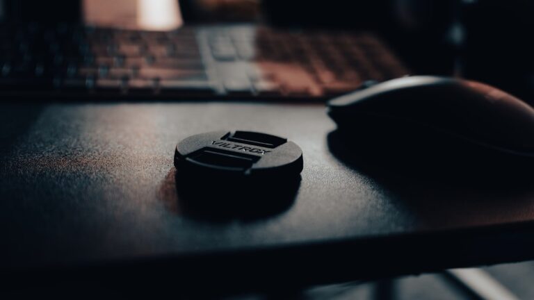 A product shot of the Viltrox AF 90mm f/2.2 EVO and 75mm f/1.8 EVO lenses side-by-side on a dark surface.