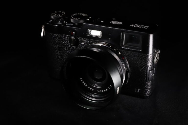 A close-up of the top dials on a black Fujifilm camera, representing the Fujifilm X-T6's rumored reworked controls.