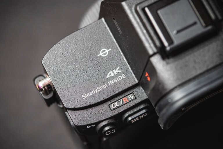 A studio product shot of the Sony a7R VI camera body, angled to show its grip and lens mount.