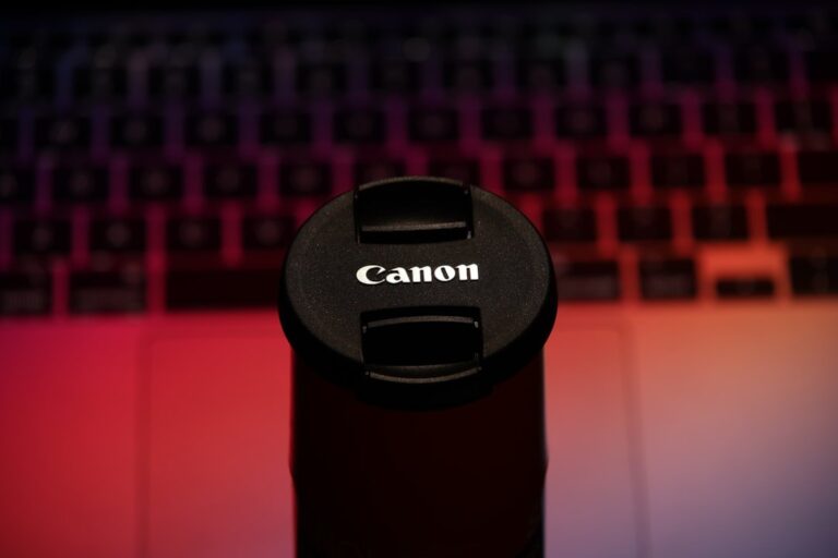 A close-up of the new Canon EOS R6 V camera body paired with the RF 20-50mm f/4L IS USM PZ lens, highlighting the power zoom controls.