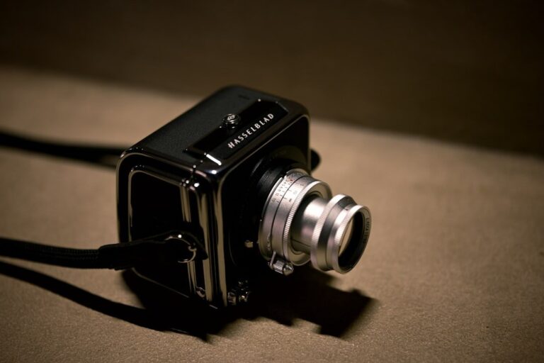A close-up of a Hasselblad medium format camera, highlighting its professional build and lens mount.