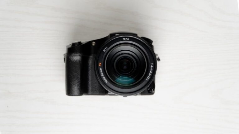 A detailed shot of the Sony RX10 V bridge camera, highlighting its large ZEISS Vario-Sonnar T* lens.