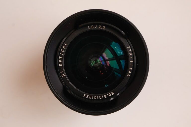 Close-up detail of the TTartisan AF 85mm f/1.8 NEO lens, showing its minimalist barrel design.